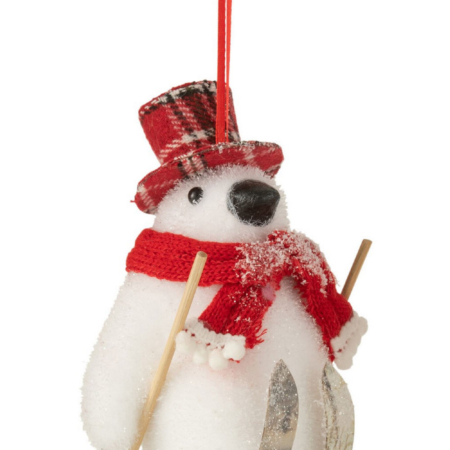 Adorno pingüino con gorro y bufanda rojo con esquís para decorar el árbol de Navidad